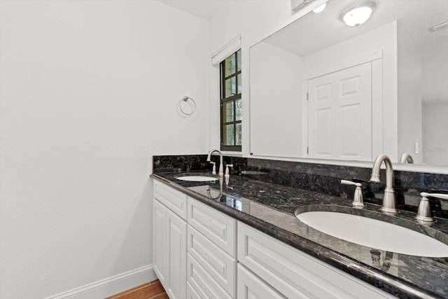 11770 W Sunnybrook Ct, Crystal River, FL 34429 - bathroom featuring double vanity and baseboards