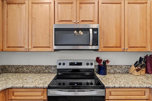 11770 W Sunnybrook Ct, Crystal River, FL 34429 - kitchen with appliances with stainless steel finishes and light stone countertops