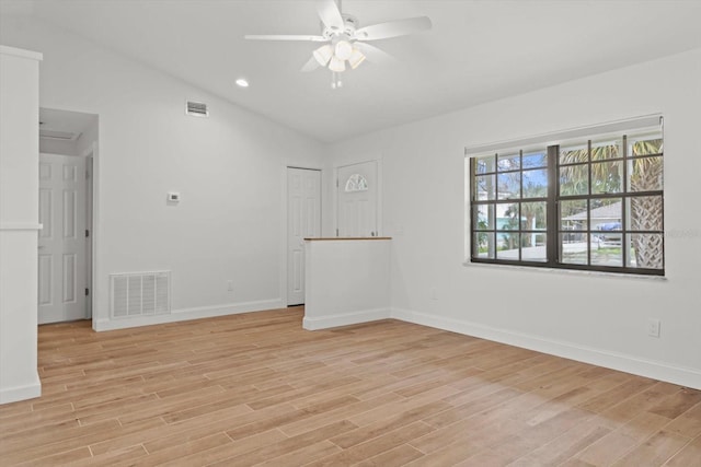 11770 W Sunnybrook Ct, Crystal River, FL 34429 - empty room featuring a ceiling fan, light wood finished floors, lofted ceiling, and recessed lighting