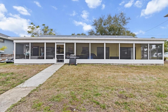 11770 W Sunnybrook Ct, Crystal River, FL 34429 - back of property featuring a sunroom and a yard
