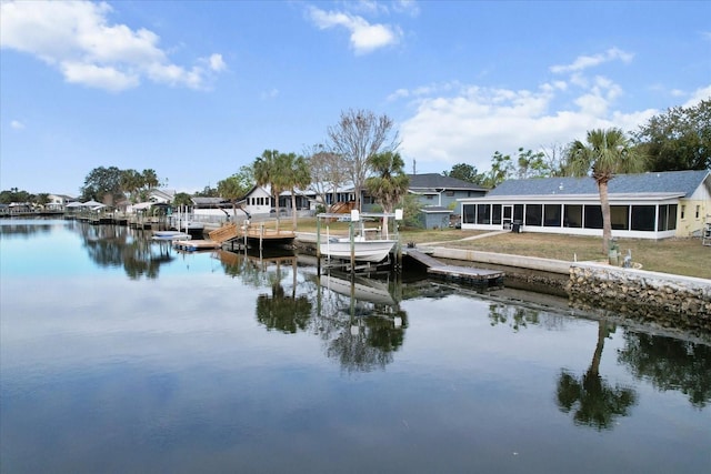 11770 W Sunnybrook Ct, Crystal River, FL 34429 - dock area with a water view, a residential view, a lawn, and boat lift