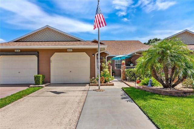 5512 Rosewall Cir, Leesburg, FL 34748 - view of front of house featuring roof with shingles and driveway
