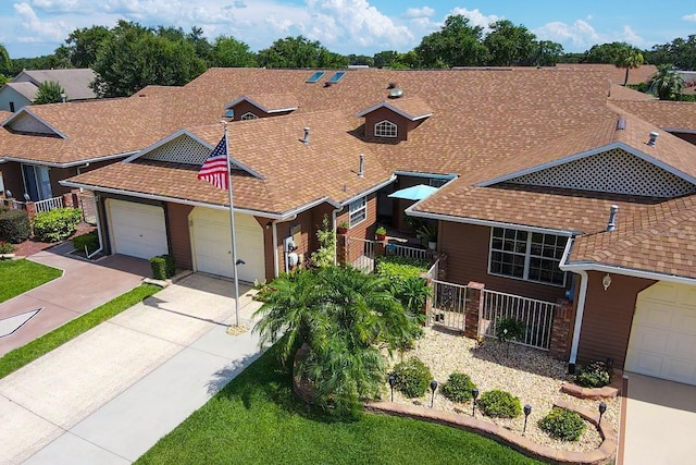 5512 Rosewall Cir, Leesburg, FL 34748 - view of front of property featuring concrete driveway, roof with shingles, and an attached garage