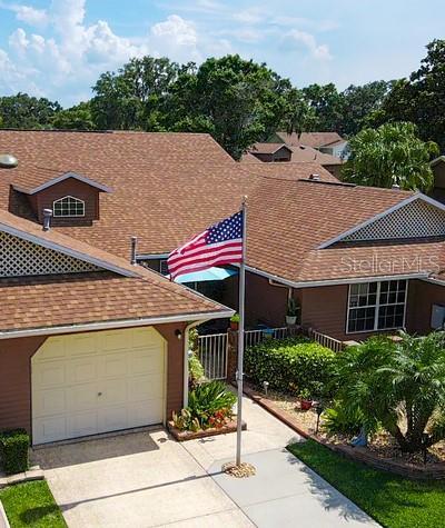 5512 Rosewall Cir, Leesburg, FL 34748 - view of front of house featuring concrete driveway and roof with shingles