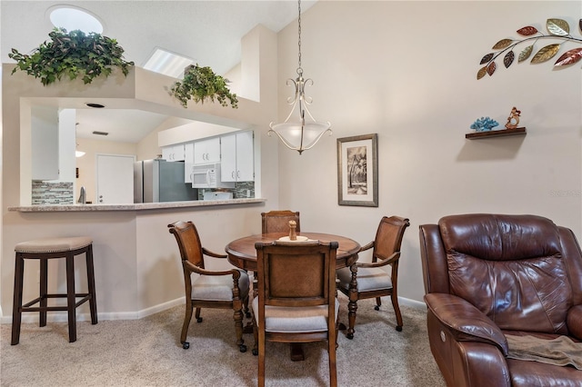 5512 Rosewall Cir, Leesburg, FL 34748 - dining space with light colored carpet and high vaulted ceiling