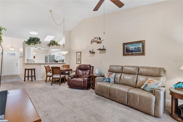 5512 Rosewall Cir, Leesburg, FL 34748 - carpeted living area with ceiling fan and high vaulted ceiling