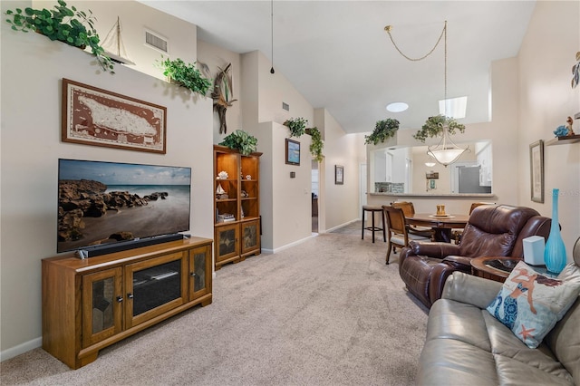 5512 Rosewall Cir, Leesburg, FL 34748 - carpeted living room featuring baseboards and high vaulted ceiling
