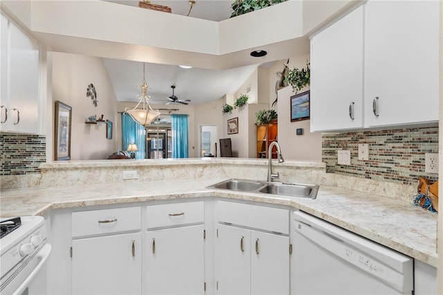 5512 Rosewall Cir, Leesburg, FL 34748 - kitchen with white appliances, light countertops, decorative backsplash, white cabinetry, and ceiling fan