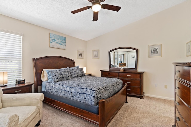 5512 Rosewall Cir, Leesburg, FL 34748 - bedroom featuring light carpet, multiple windows, ceiling fan, vaulted ceiling, and a textured ceiling
