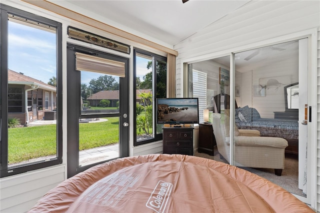 5512 Rosewall Cir, Leesburg, FL 34748 - bedroom featuring lofted ceiling and access to outside