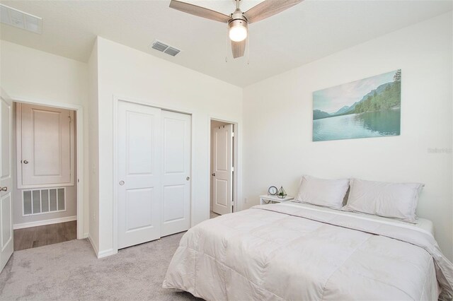 1696 Wilson Prairie Cir, Groveland, FL 34736 - carpeted bedroom featuring a closet and a ceiling fan
