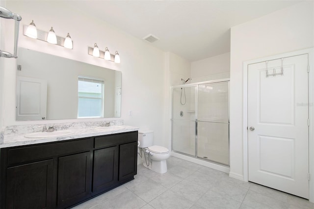 1696 Wilson Prairie Cir, Groveland, FL 34736 - bathroom with a shower stall, double vanity, and tile patterned floors