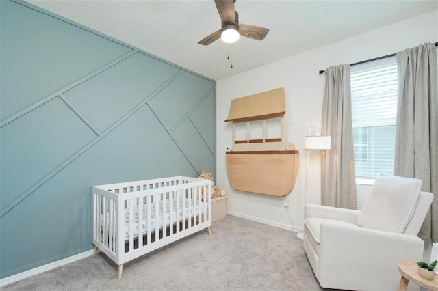 1696 Wilson Prairie Cir, Groveland, FL 34736 - carpeted bedroom featuring multiple windows, a nursery area, and ceiling fan