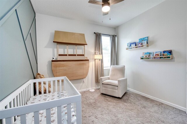 1696 Wilson Prairie Cir, Groveland, FL 34736 - bedroom with a nursery area, carpet, and a ceiling fan