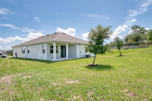 1696 Wilson Prairie Cir, Groveland, FL 34736 - view of side of property with a yard, stucco siding, and roof with shingles
