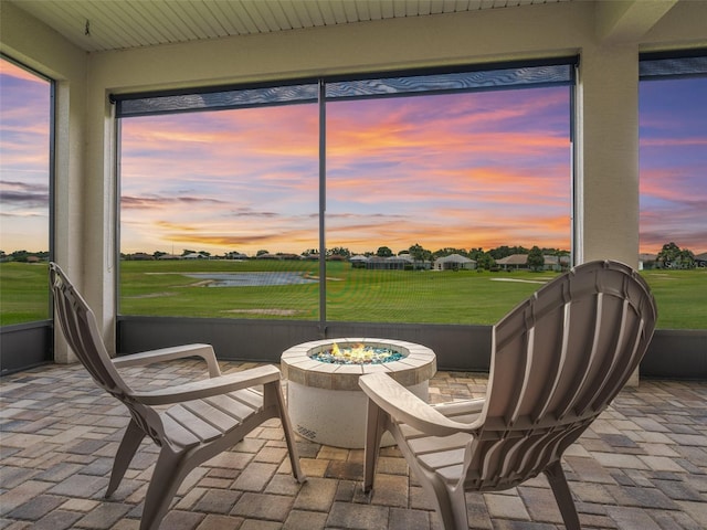 12198 SE 176th Loop, Summerfield, FL 34491 - sunroom with a fire pit and a water view