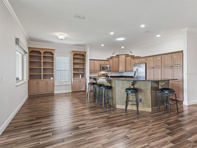 12198 SE 176th Loop, Summerfield, FL 34491 - kitchen featuring appliances with stainless steel finishes, a breakfast bar, dark wood-type flooring, dark countertops, and recessed lighting