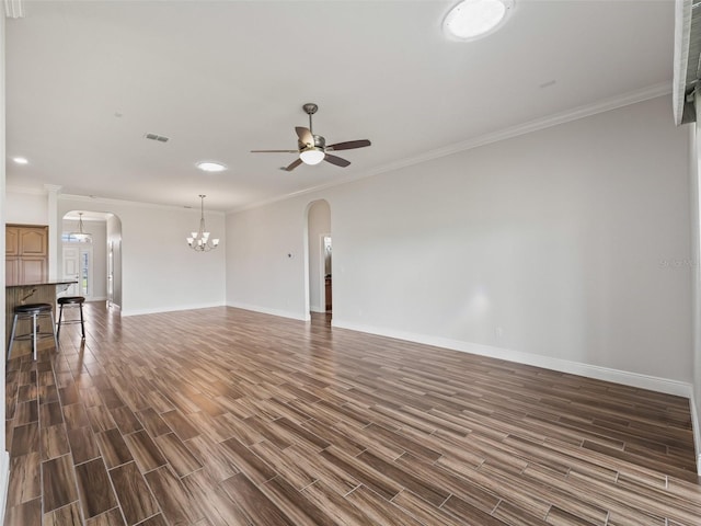 12198 SE 176th Loop, Summerfield, FL 34491 - unfurnished living room featuring arched walkways, a chandelier, dark wood-style flooring, a ceiling fan, and ornamental molding