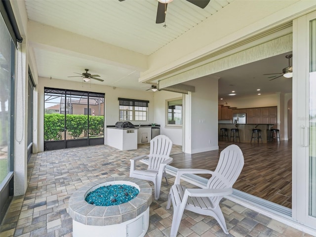 12198 SE 176th Loop, Summerfield, FL 34491 - sunroom / solarium with ceiling fan and an outdoor kitchen