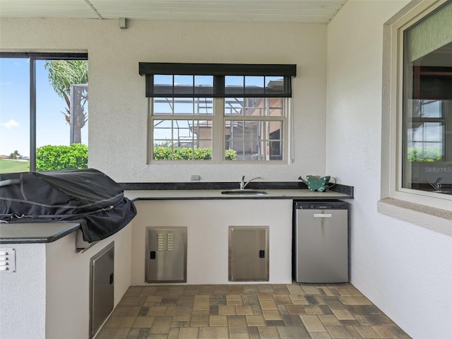 12198 SE 176th Loop, Summerfield, FL 34491 - view of patio / terrace with a sink and an outdoor kitchen