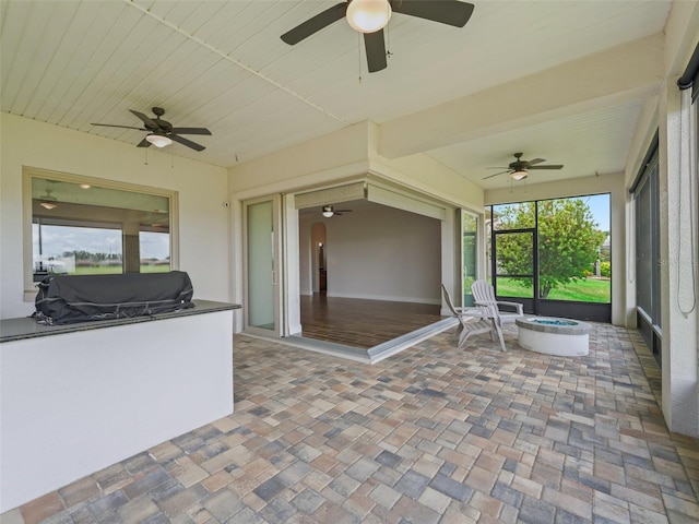 12198 SE 176th Loop, Summerfield, FL 34491 - unfurnished sunroom with a ceiling fan, area for grilling, and healthy amount of natural light