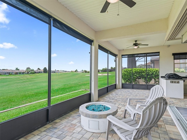 12198 SE 176th Loop, Summerfield, FL 34491 - sunroom featuring ceiling fan and a fire pit