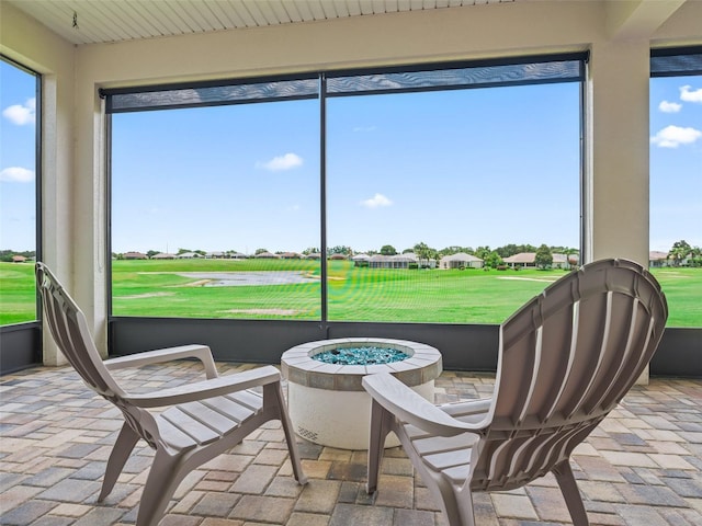 12198 SE 176th Loop, Summerfield, FL 34491 - sunroom featuring a fire pit and golf course view