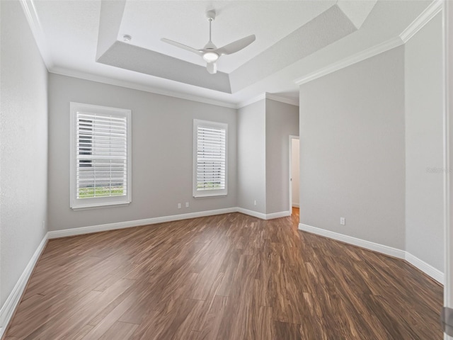 12198 SE 176th Loop, Summerfield, FL 34491 - spare room with a tray ceiling, wood finished floors, a ceiling fan, and crown molding