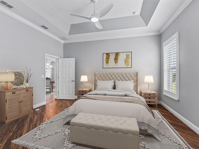 12198 SE 176th Loop, Summerfield, FL 34491 - bedroom featuring a raised ceiling, wood finished floors, ornamental molding, and ceiling fan