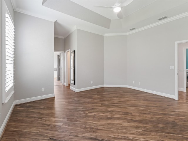 12198 SE 176th Loop, Summerfield, FL 34491 - unfurnished room featuring ceiling fan, healthy amount of natural light, dark wood-style floors, crown molding, and a raised ceiling