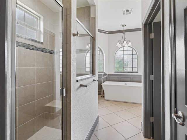 12198 SE 176th Loop, Summerfield, FL 34491 - full bathroom with healthy amount of natural light, a soaking tub, a stall shower, ornamental molding, and tile patterned floors