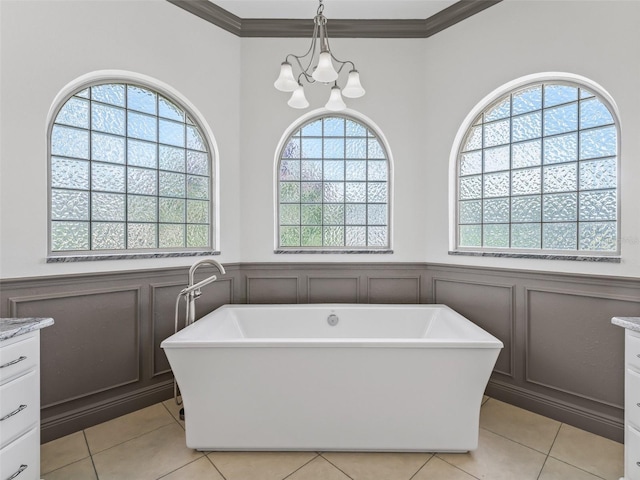 12198 SE 176th Loop, Summerfield, FL 34491 - bathroom featuring vanity, plenty of natural light, a decorative wall, a freestanding bath, and a wainscoted wall
