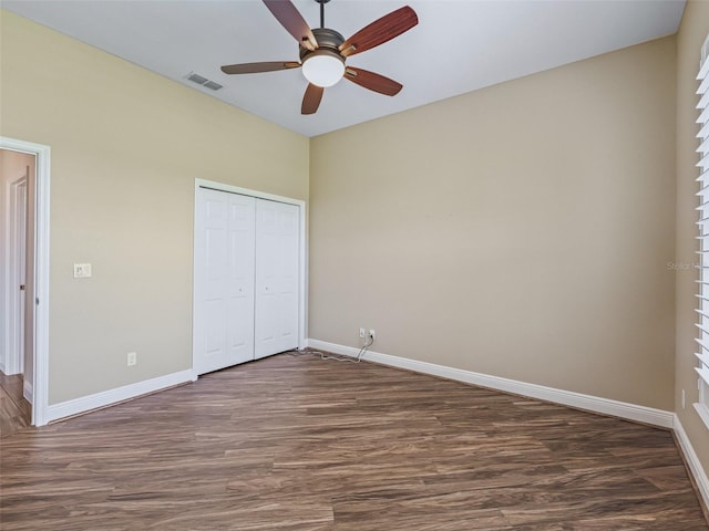 12198 SE 176th Loop, Summerfield, FL 34491 - unfurnished bedroom with dark wood-style floors, a closet, and ceiling fan