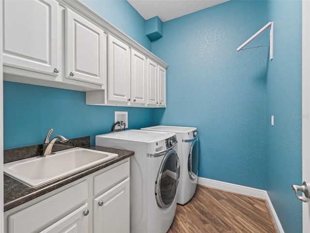 12198 SE 176th Loop, Summerfield, FL 34491 - laundry area featuring cabinet space, washing machine and dryer, and wood finished floors