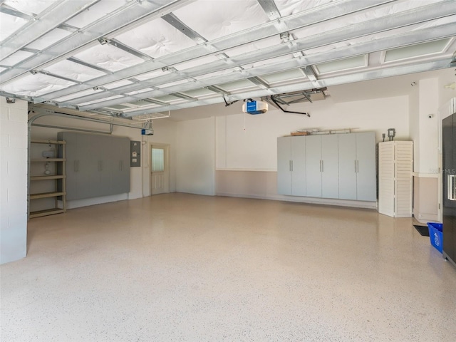 12198 SE 176th Loop, Summerfield, FL 34491 - garage featuring a garage door opener and electric panel