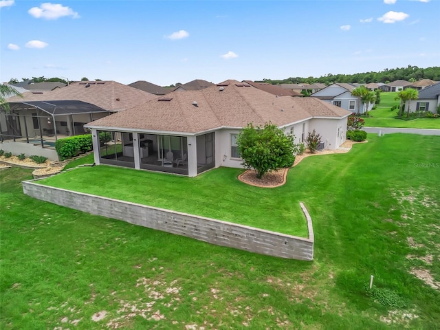 12198 SE 176th Loop, Summerfield, FL 34491 - rear view of property with a residential view, a lawn, a sunroom, and stucco siding