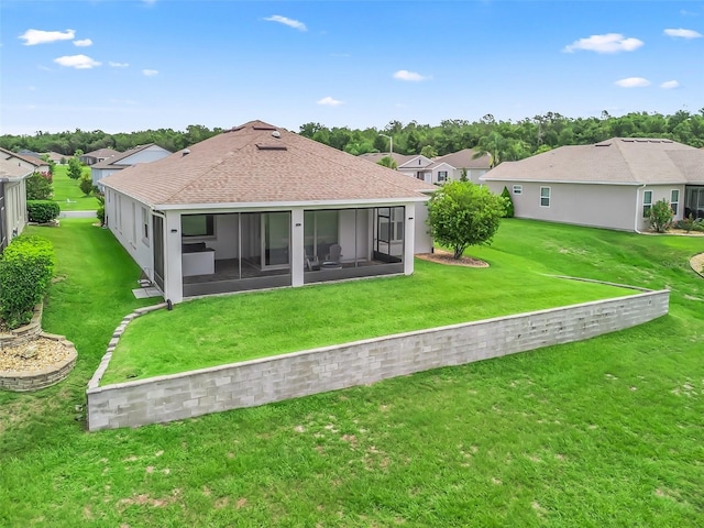 12198 SE 176th Loop, Summerfield, FL 34491 - rear view of house featuring a lawn, a residential view, a sunroom, and roof with shingles