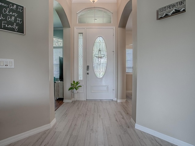 359 Blue Branch St, Eustis, FL 32736 - entrance foyer with arched walkways and wood finished floors