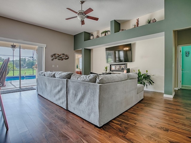 359 Blue Branch St, Eustis, FL 32736 - living room featuring ceiling fan, dark wood-type flooring, and a textured ceiling
