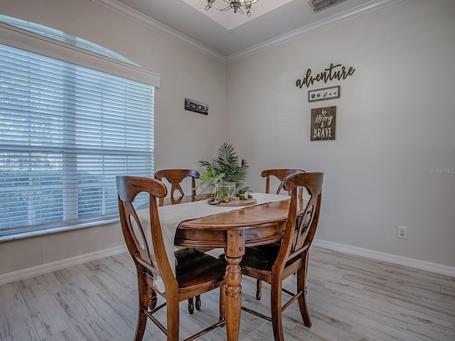 359 Blue Branch St, Eustis, FL 32736 - dining room with light wood-type flooring, crown molding, and a chandelier