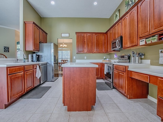 359 Blue Branch St, Eustis, FL 32736 - kitchen featuring appliances with stainless steel finishes, a kitchen island, light countertops, a chandelier, and light tile patterned floors