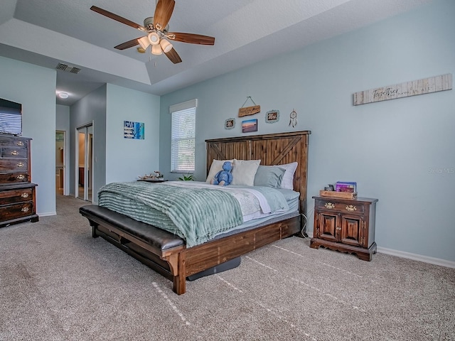 359 Blue Branch St, Eustis, FL 32736 - bedroom with carpet floors, a tray ceiling, and a ceiling fan
