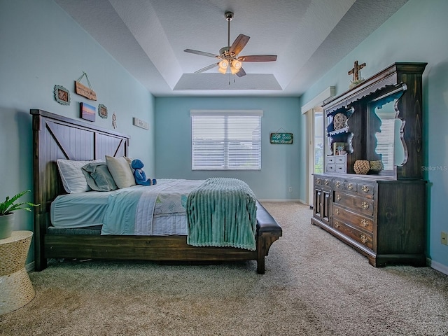 359 Blue Branch St, Eustis, FL 32736 - bedroom with a raised ceiling, carpet flooring, ceiling fan, and a textured ceiling