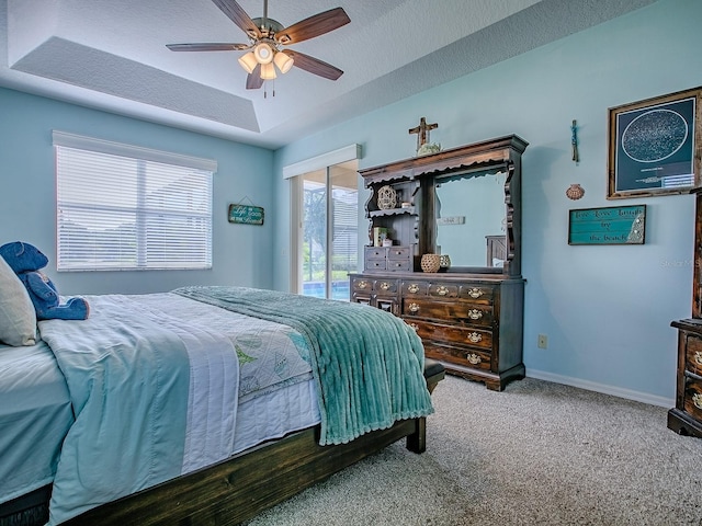 359 Blue Branch St, Eustis, FL 32736 - bedroom featuring carpet, a raised ceiling, ceiling fan, and a textured ceiling