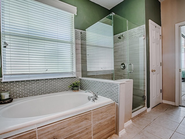 359 Blue Branch St, Eustis, FL 32736 - full bath with a garden tub, a shower stall, and tile patterned flooring