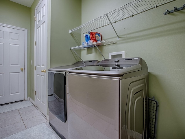 359 Blue Branch St, Eustis, FL 32736 - laundry room with washer and dryer and light tile patterned floors