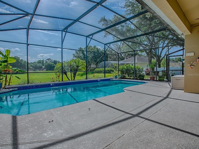 359 Blue Branch St, Eustis, FL 32736 - swimming pool featuring a patio, glass enclosure, and a lawn
