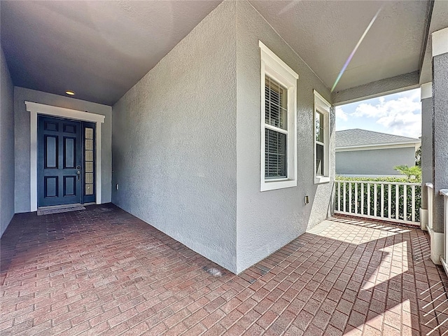 101 Flame Vine Way, Groveland, FL 34736 - doorway to property featuring stucco siding