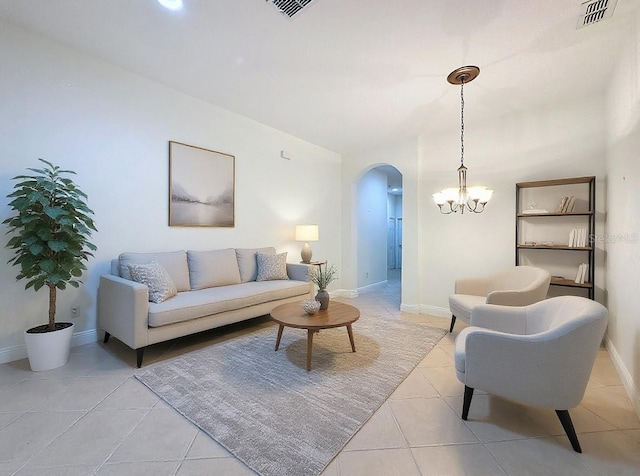 101 Flame Vine Way, Groveland, FL 34736 - living area with arched walkways, light tile patterned flooring, and a chandelier