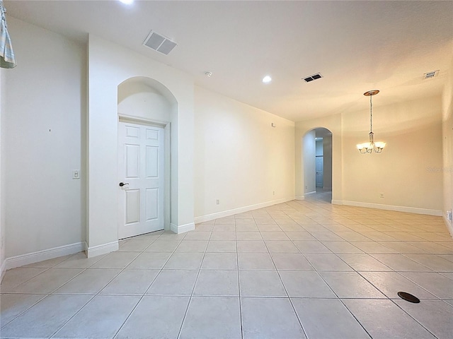 101 Flame Vine Way, Groveland, FL 34736 - unfurnished room featuring arched walkways, light tile patterned flooring, a chandelier, and recessed lighting